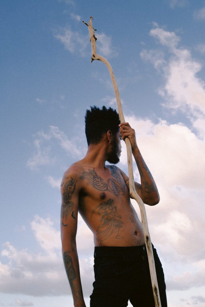 man-in-black-shorts-holding-a-stick-3444534-scaled-e1581501116485